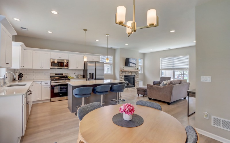 a kitchen with blue stools