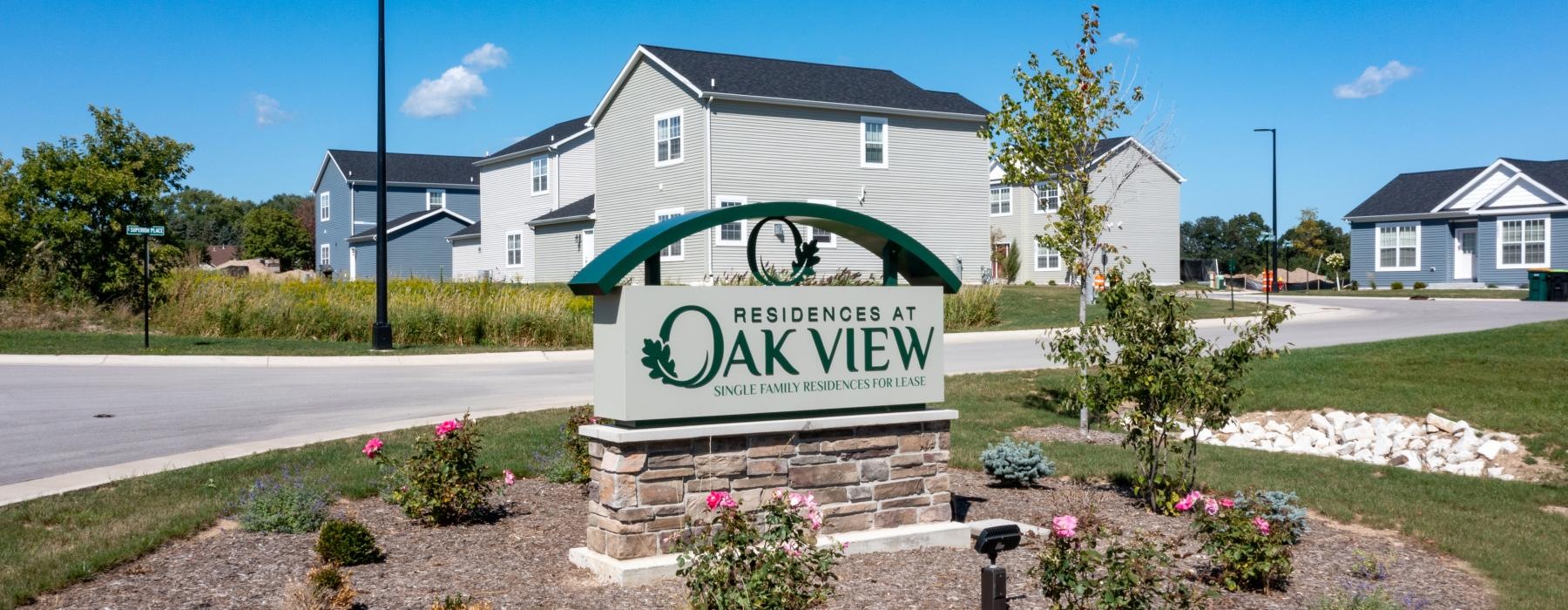 a sign in front of a house