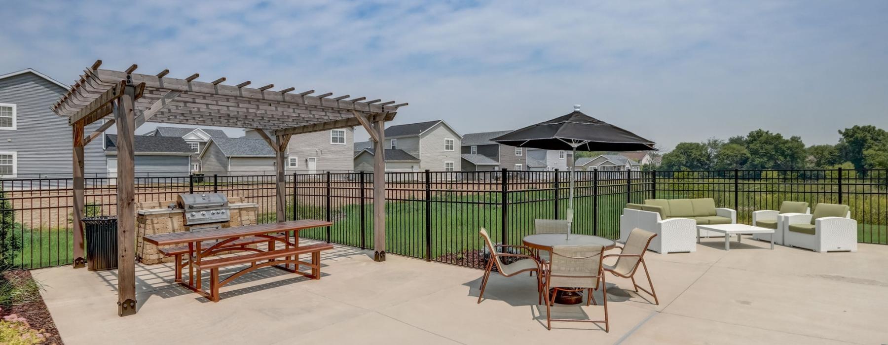 a patio with tables and chairs