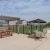 a patio with tables and chairs
