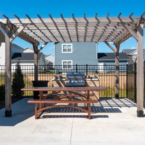 a table and chairs outside a building