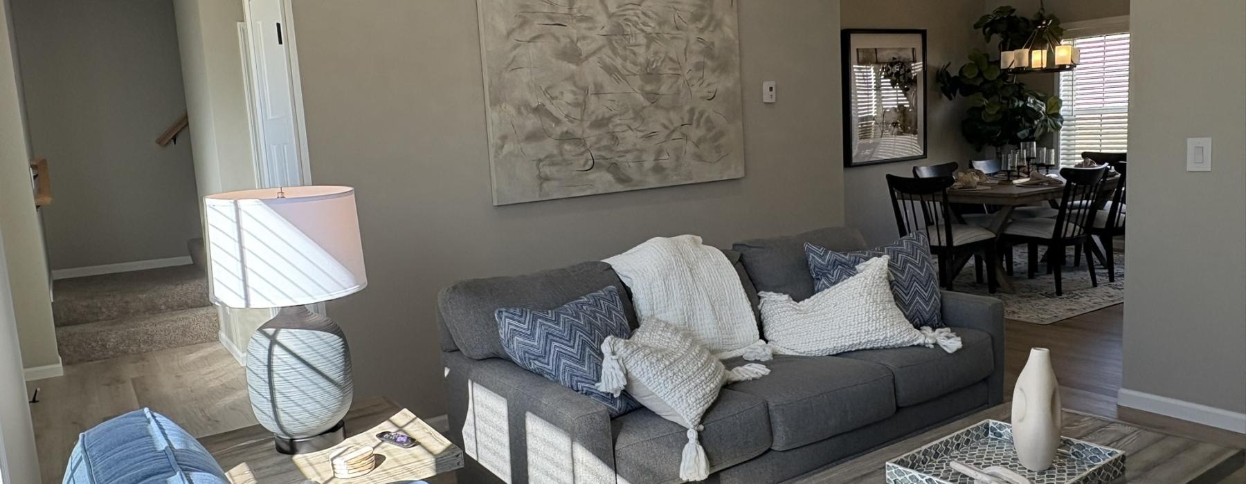 a living room with a couch and coffee table