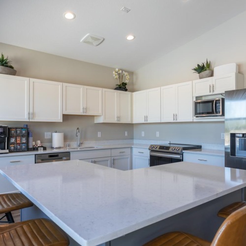 a kitchen with white cabinets