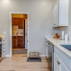 a kitchen with white cabinets