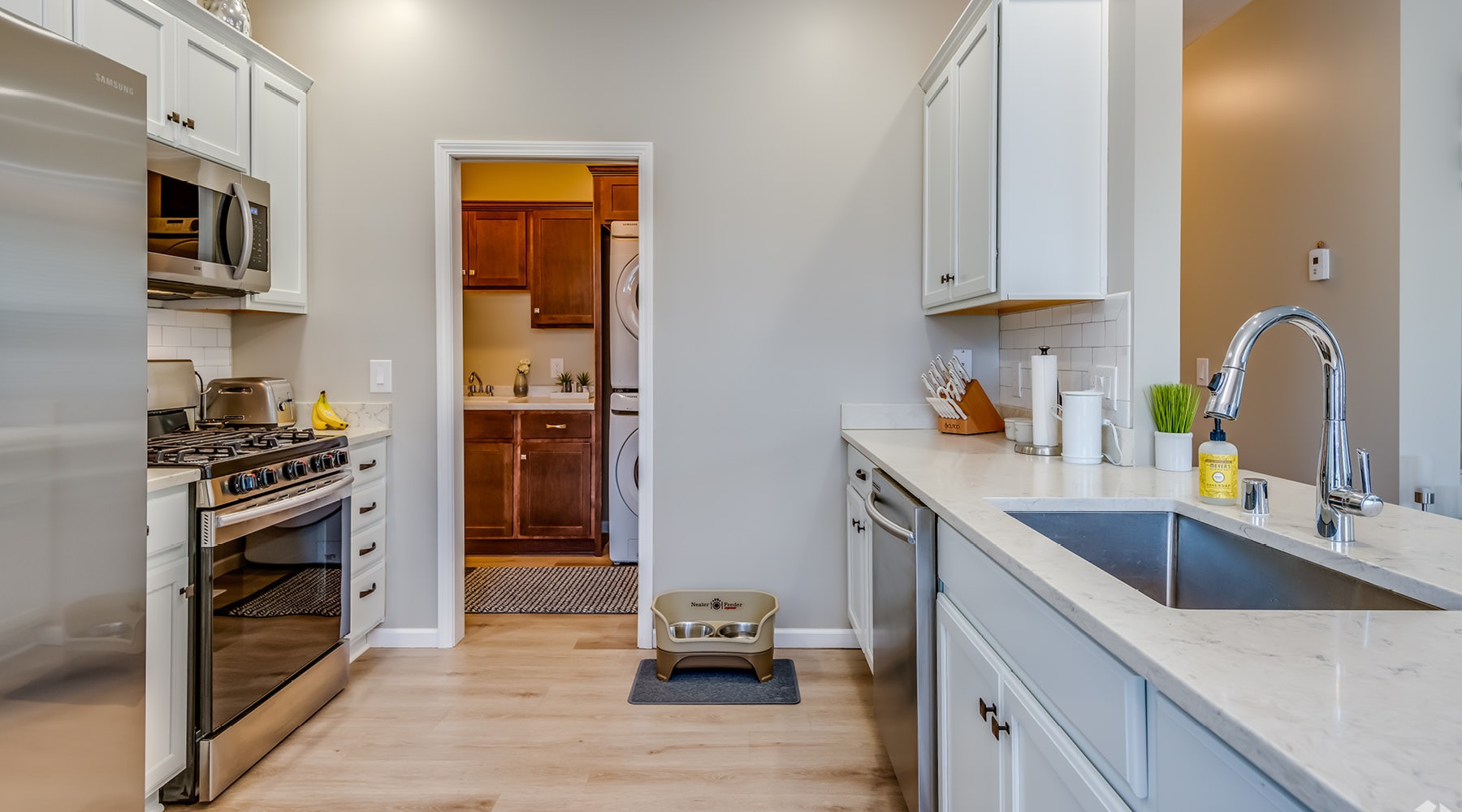 a kitchen with white cabinets
