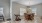 a dining room with a table and chairs